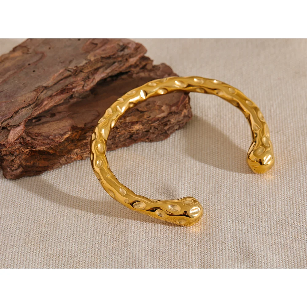 Radiant Resilience: Gold-Plated Hammered Stainless Steel Bracelet