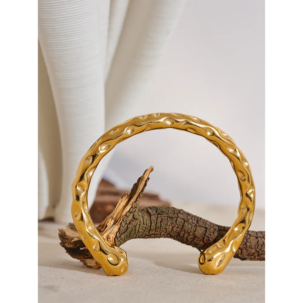 Radiant Resilience: Gold-Plated Hammered Stainless Steel Bracelet