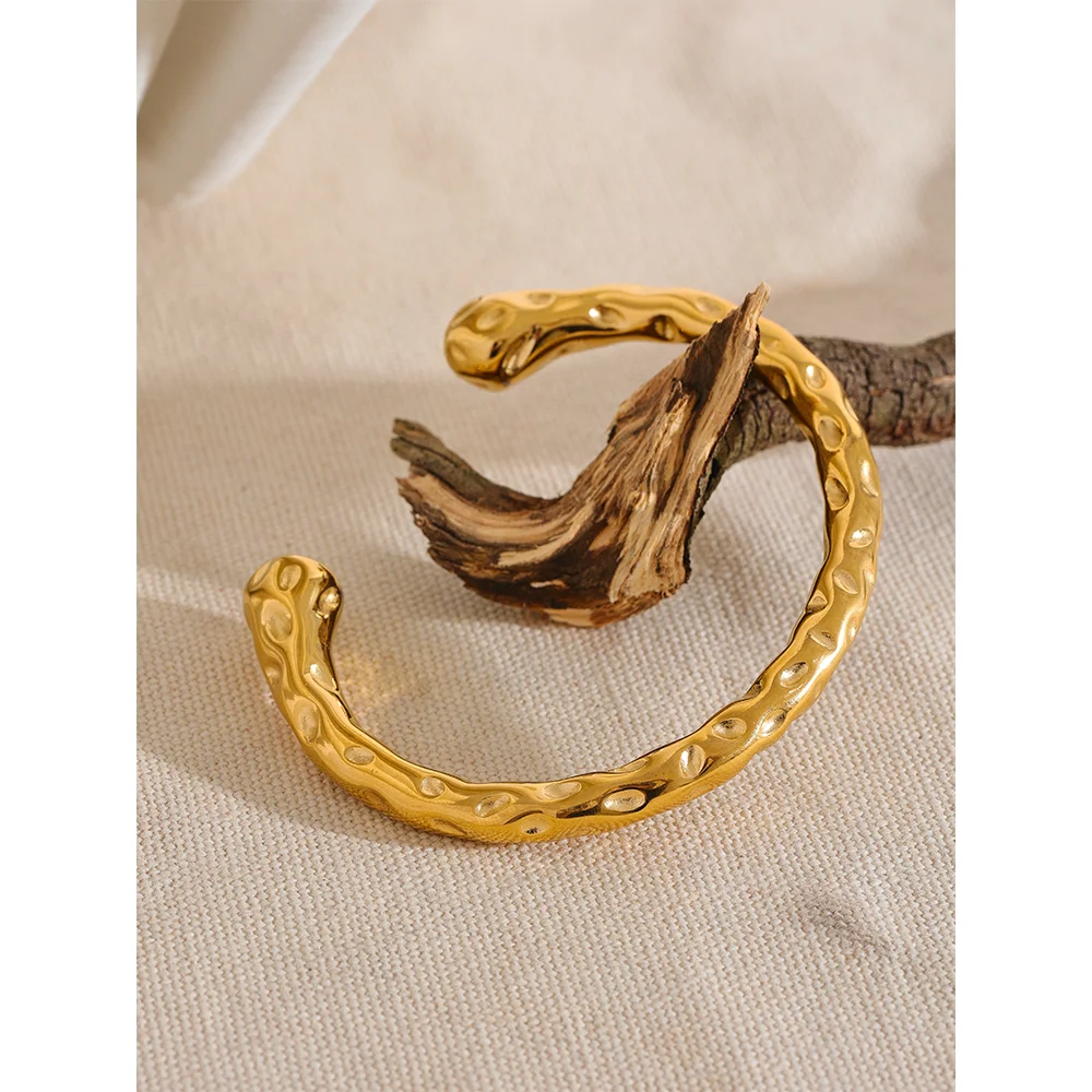 Radiant Resilience: Gold-Plated Hammered Stainless Steel Bracelet